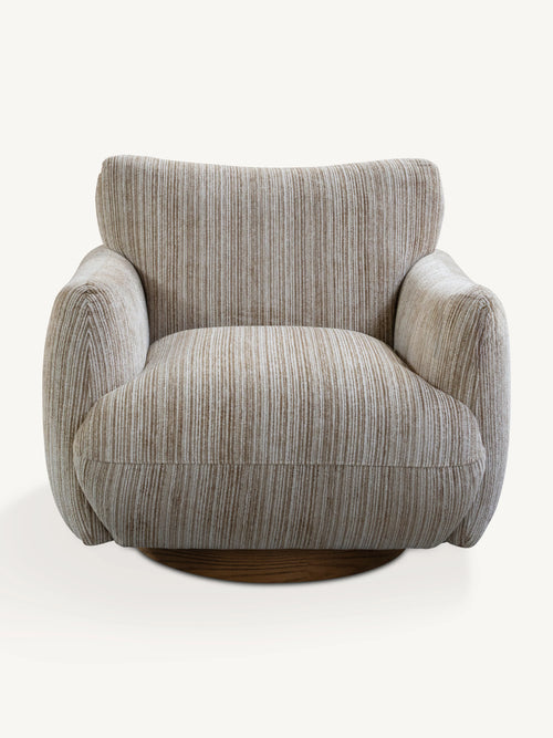 A modern swivel armchair upholstered in a textured beige and gray vertically striped fabric, featuring a dark wood circular base, shown against a plain off-white background.