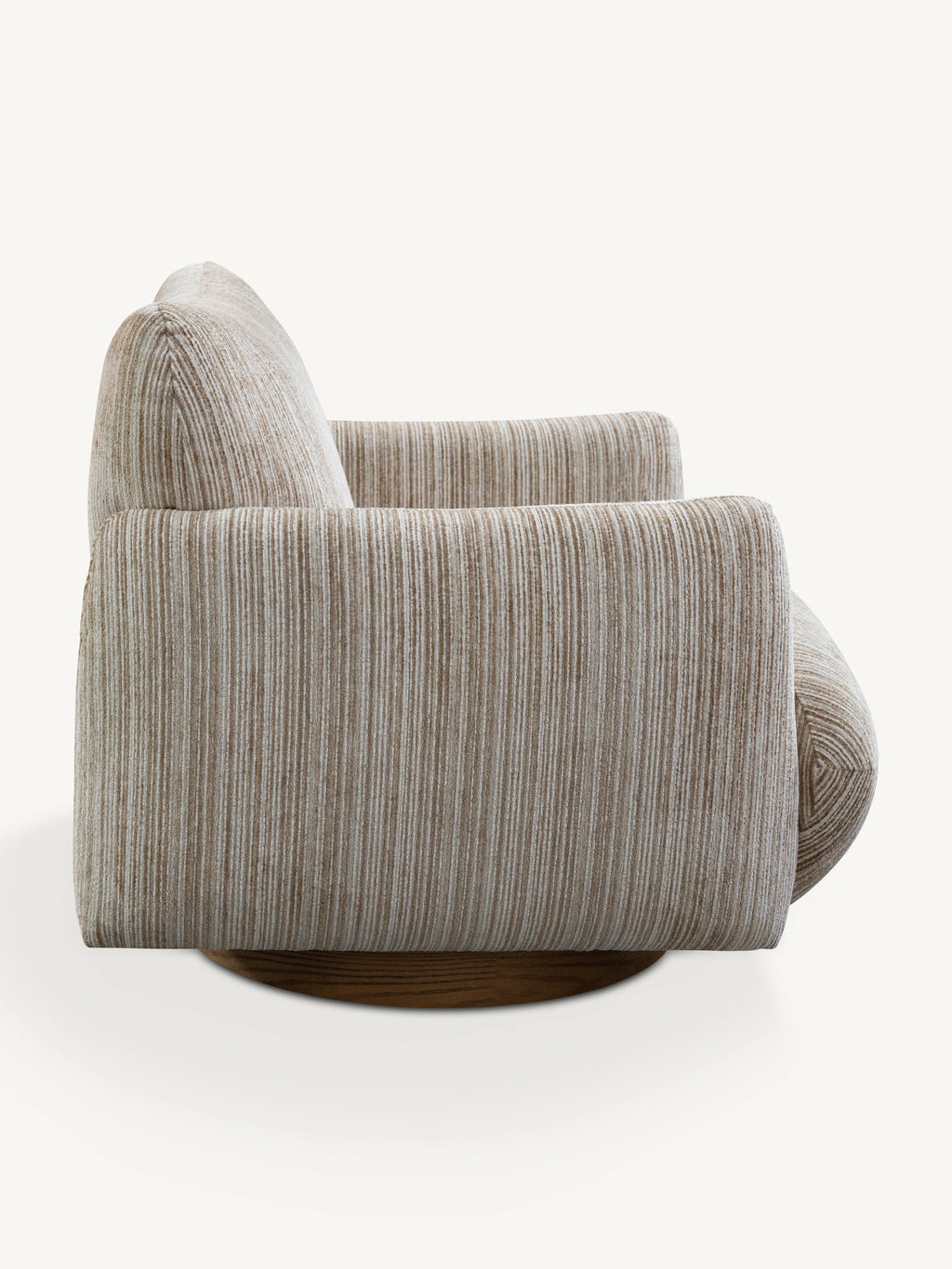 A modern swivel armchair upholstered in a textured beige and gray vertically striped fabric, shown from a three-quarters angle on a light cream background.