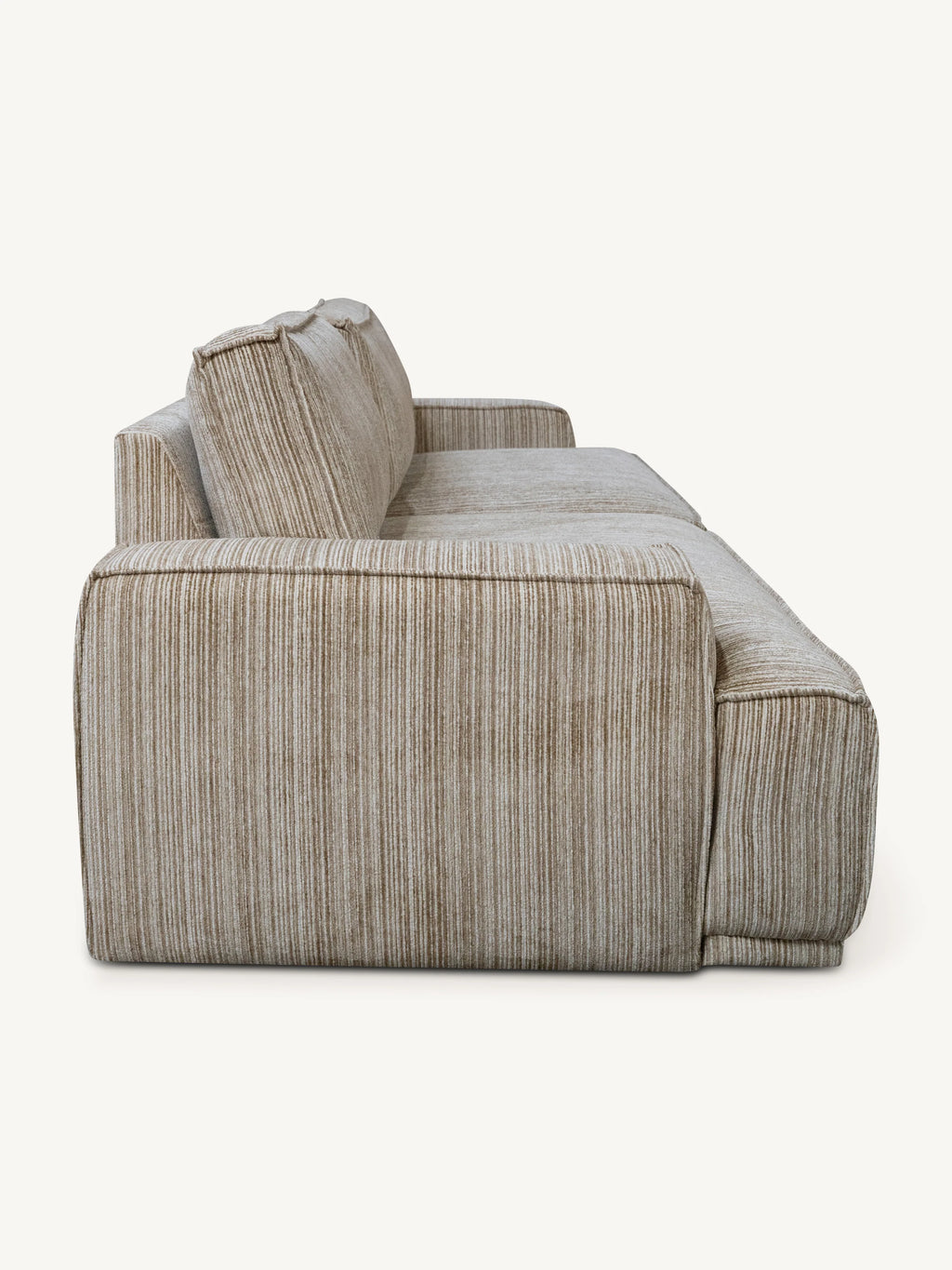A modern sectional sofa upholstered in a textured, vertically striped beige and taupe fabric, shown from a side profile view against a solid off-white background.