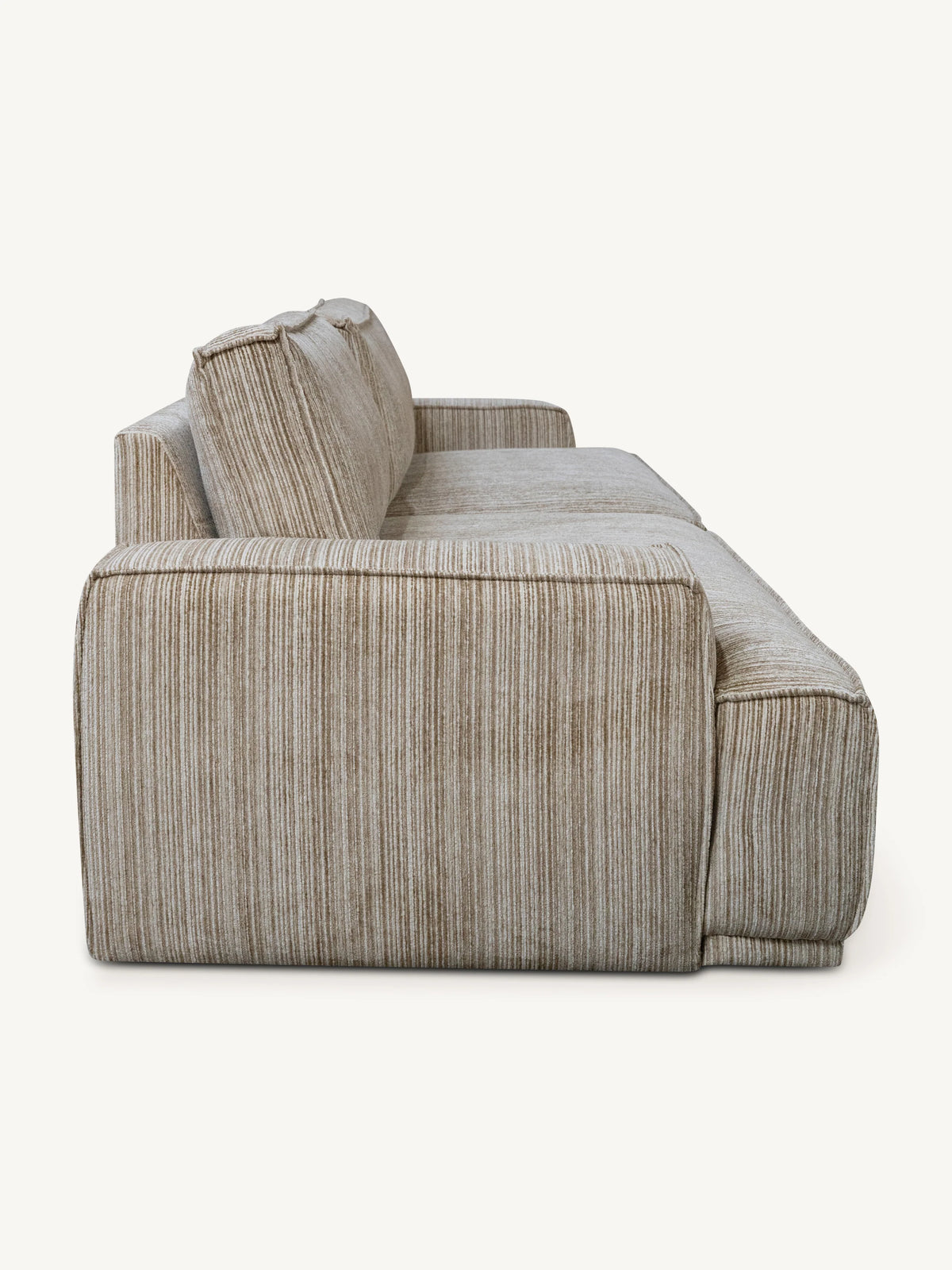 A modern sectional sofa upholstered in a textured, vertically striped beige and taupe fabric, shown from a side profile view against a solid off-white background.