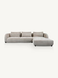 A modern sectional sofa with a right-facing chaise lounge, upholstered in a light beige textured fabric, shown against a plain off-white background.